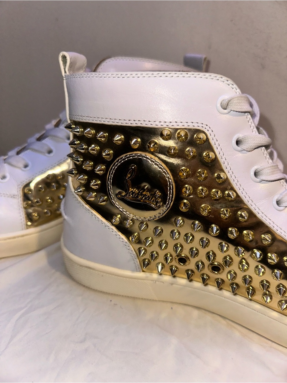 Christian Louboutin White Leather High-Top Sneakers with Gold Spike Panel
